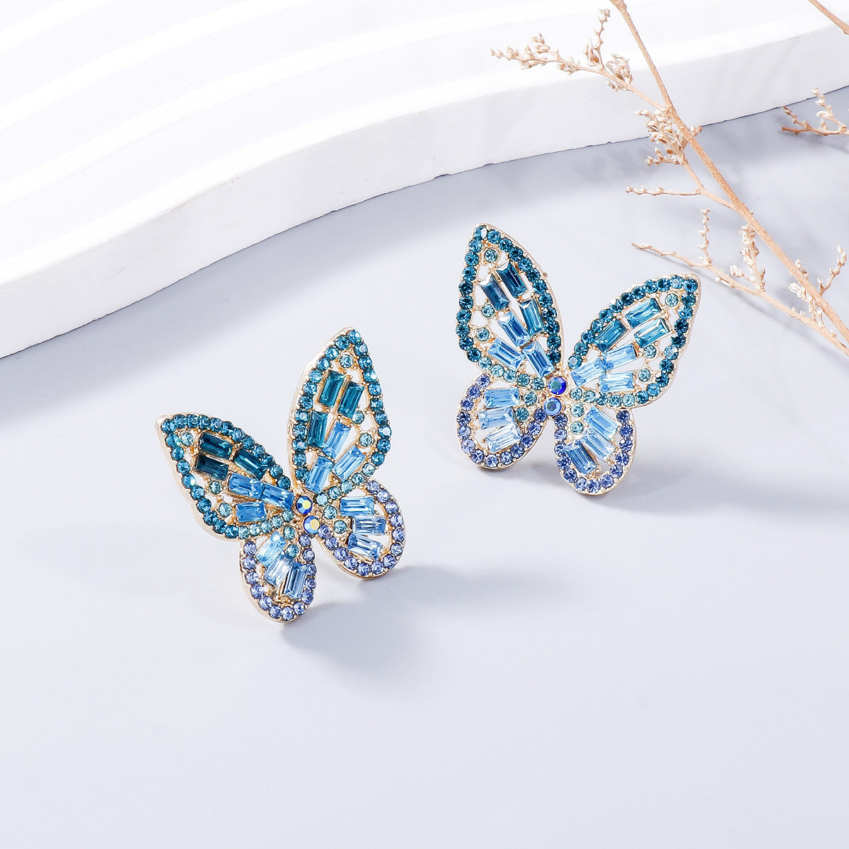 Alloy Inlaid Rhinestone Butterfly Earrings - Premium Earrings from Trendsi - Just $11! Shop now at Ida Louise Boutique