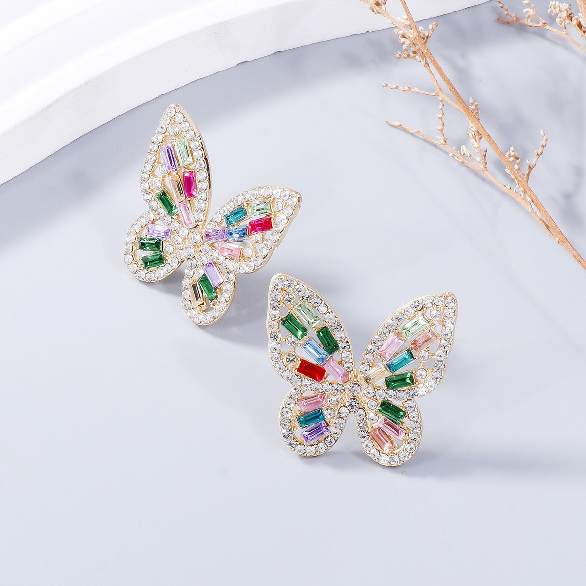 Alloy Inlaid Rhinestone Butterfly Earrings - Premium Earrings from Trendsi - Just $11! Shop now at Ida Louise Boutique