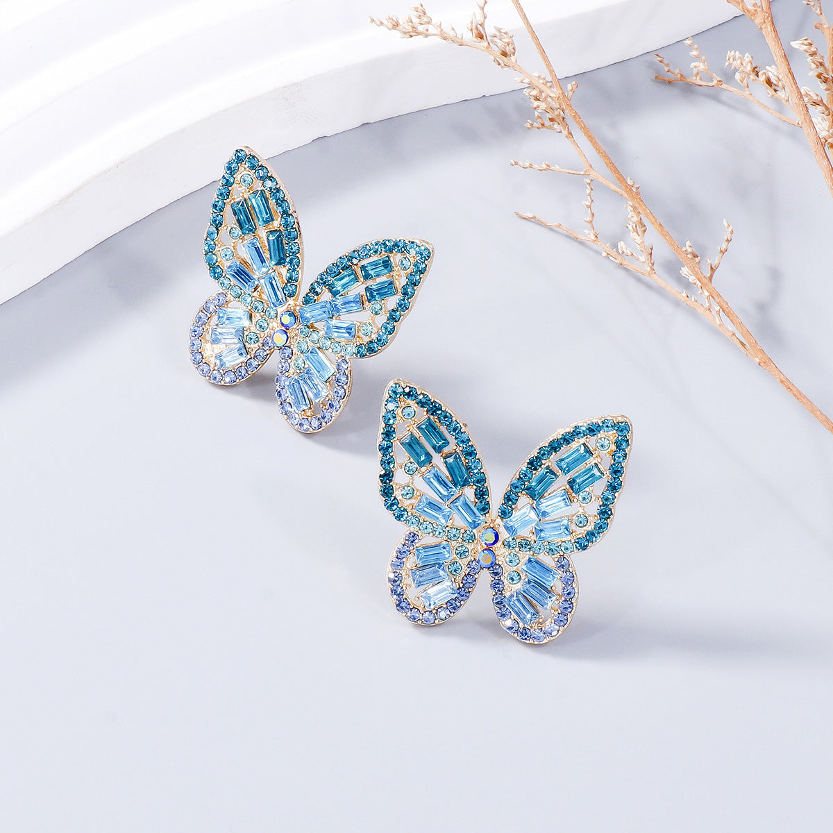 Alloy Inlaid Rhinestone Butterfly Earrings - Premium Earrings from Trendsi - Just $11! Shop now at Ida Louise Boutique