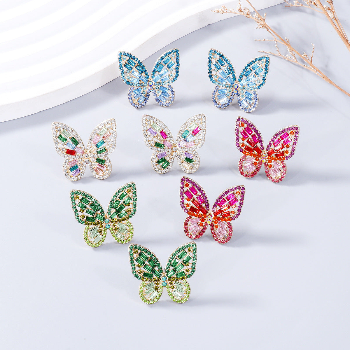 Alloy Inlaid Rhinestone Butterfly Earrings - Premium Earrings from Trendsi - Just $11! Shop now at Ida Louise Boutique