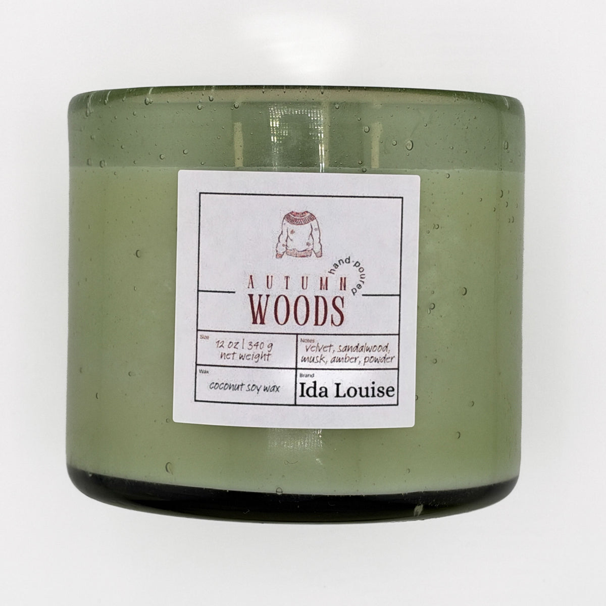 Ida Louise Autumn Woods candle, 12 oz coconut soy wax in a green bubble-glass jar