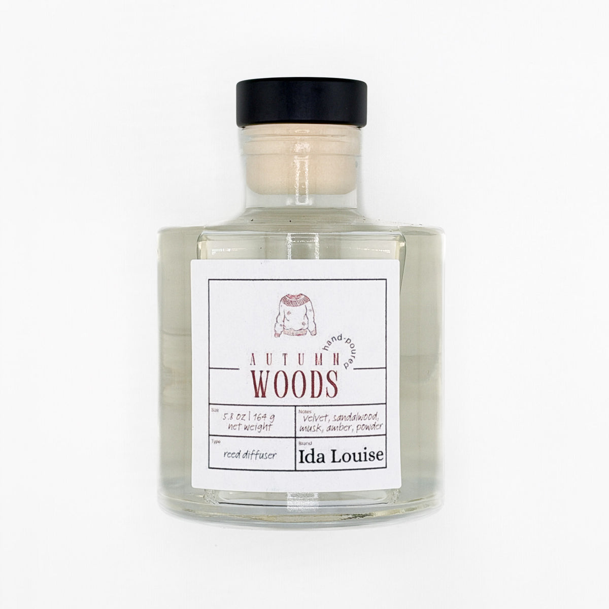 Ida Louise Autumn Woods reed diffuser, 5.8 oz glass bottle with a black cap