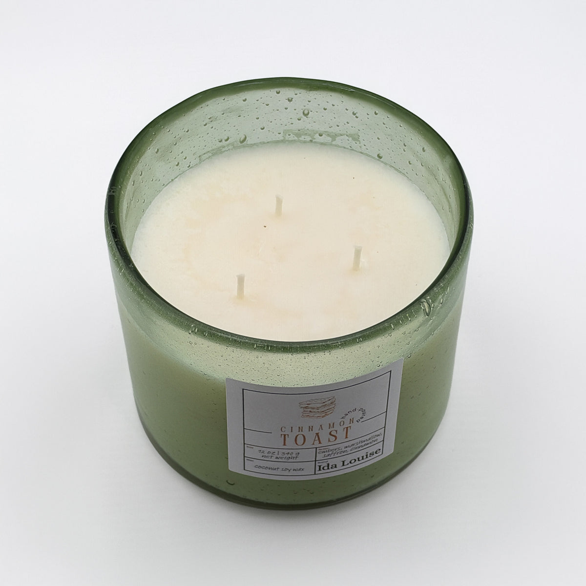 Top view of the Ida Louise Cinnamon Toast candle showing three wicks in coconut soy wax