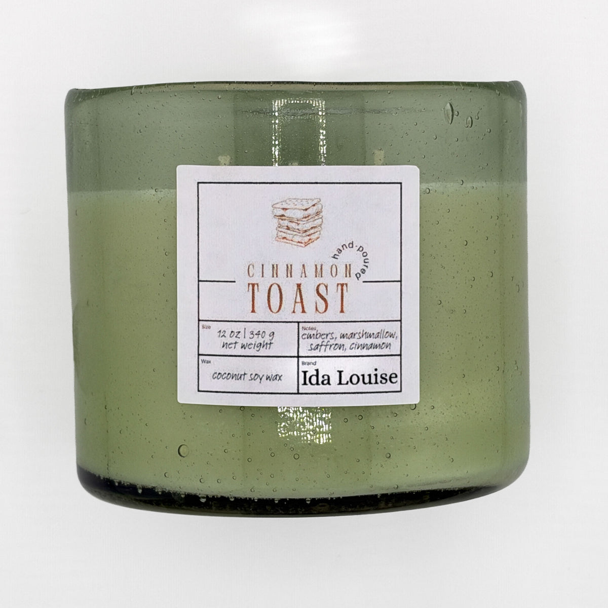 Ida Louise Cinnamon Toast candle, 12 oz coconut soy wax in a green bubble-glass jar