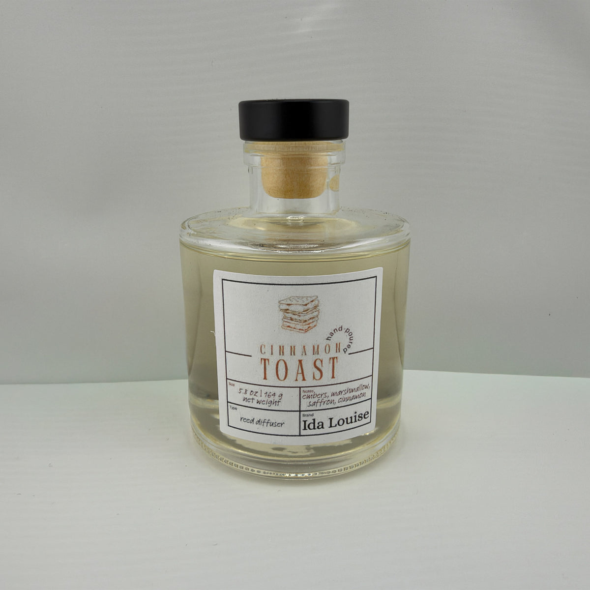 Ida Louise Cinnamon Toast reed diffuser, 5.8 oz glass bottle with a black cap